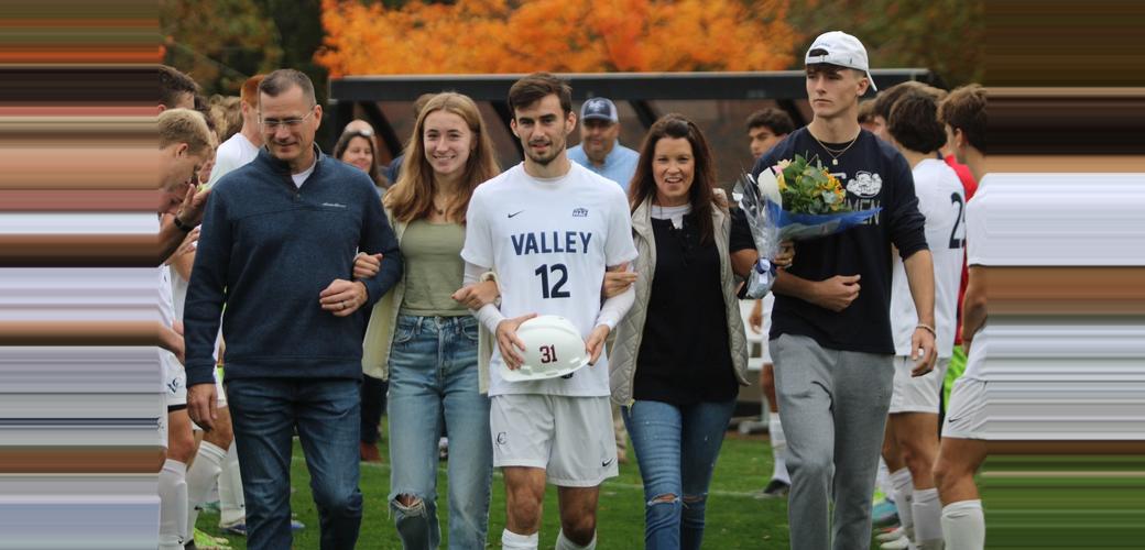 Zach Reed with family on soccer senior day