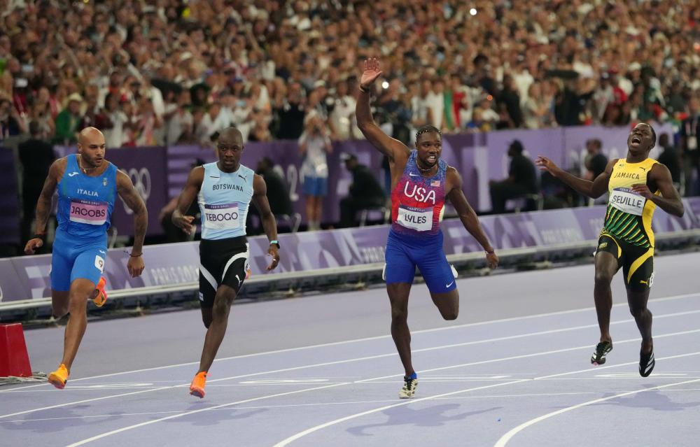 News - Noah Lyles Earns 'Fastest Man' Acclaim By .005 Seconds In Olympic 100 Meters Final